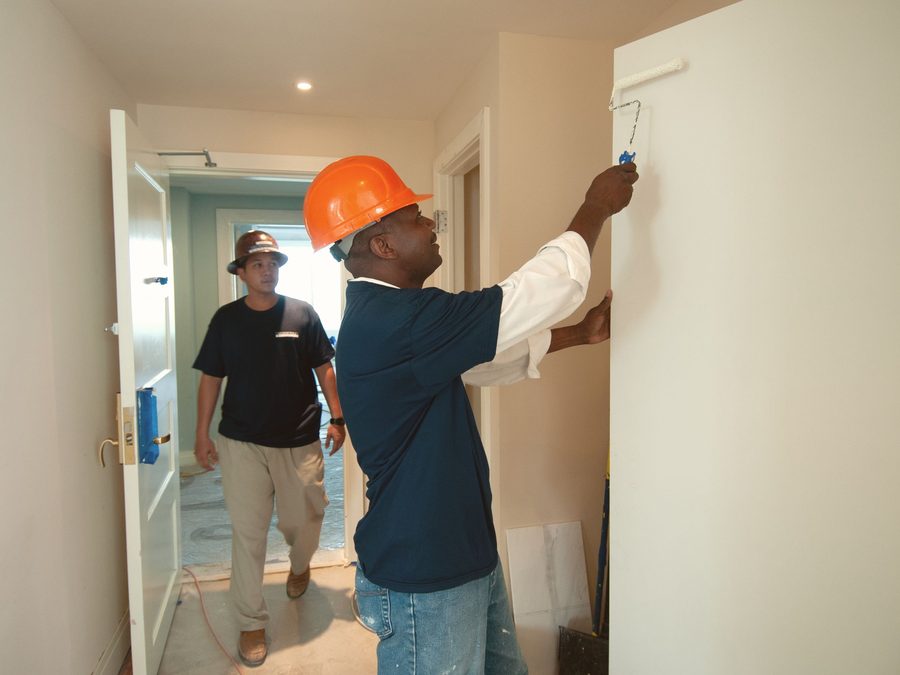 Workers finishing an interior renovation