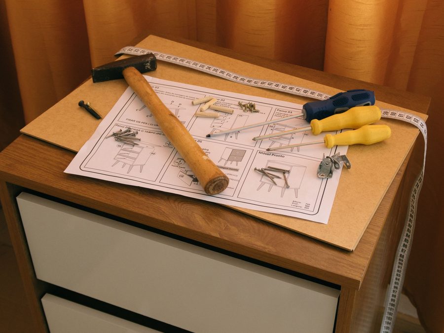 Flat-pack furniture with instructions and tools ready for assembly